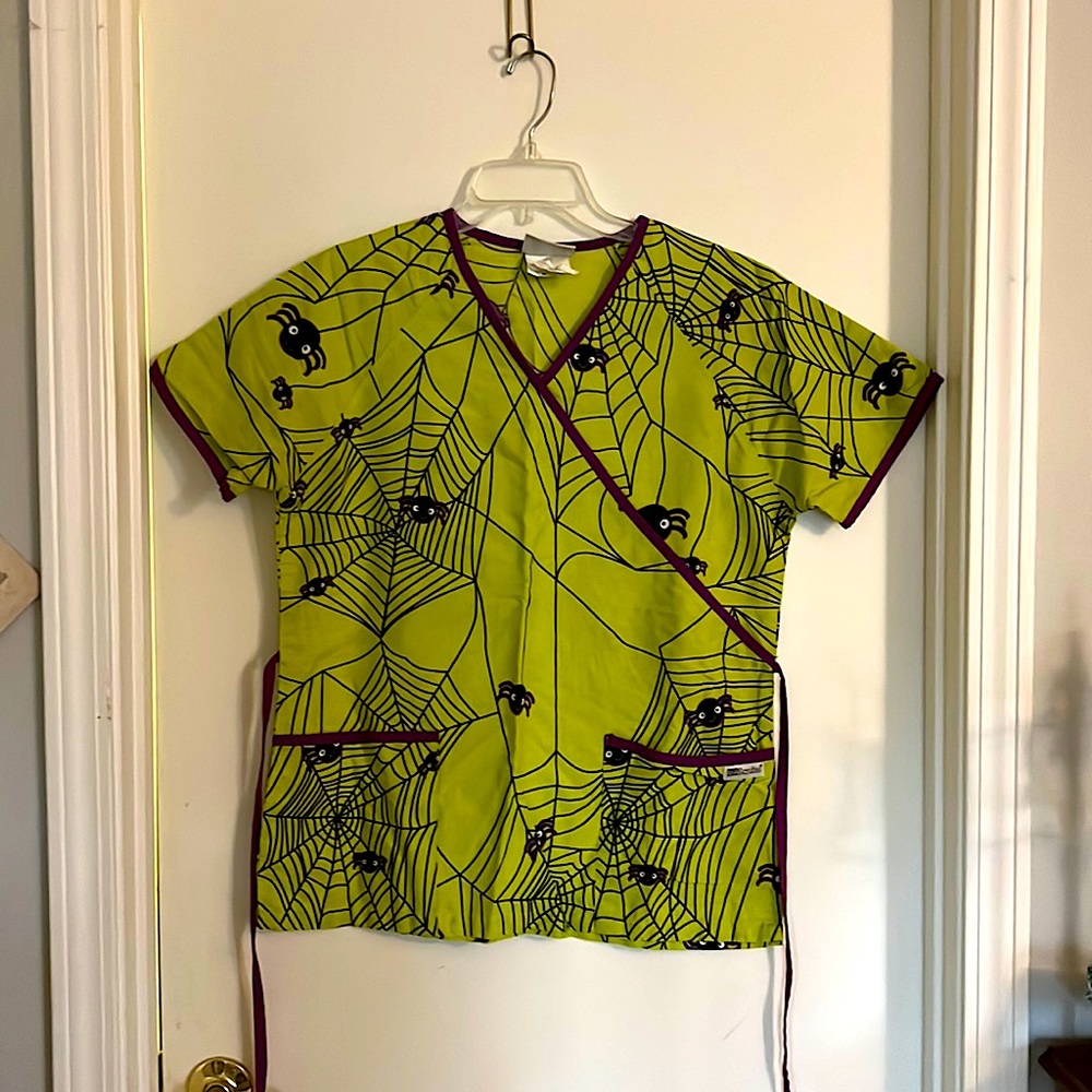 Woman’s Halloween-themed Scrub Top